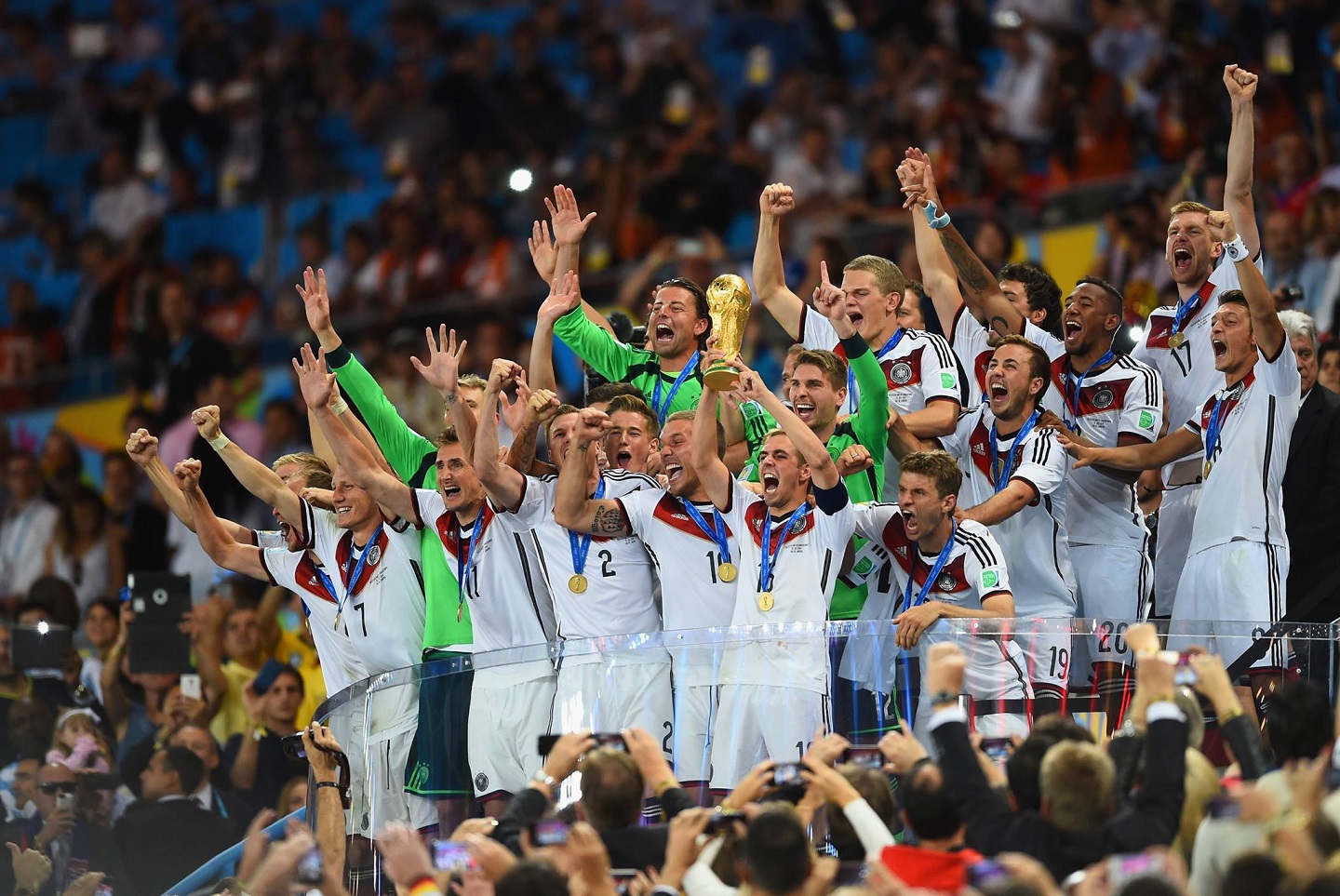 Germany's players celebrate after their team won the 2014 FIFA World C...